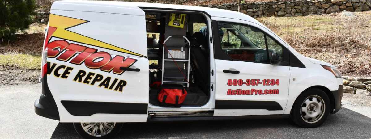 Appliance repair van with open door showing tools.